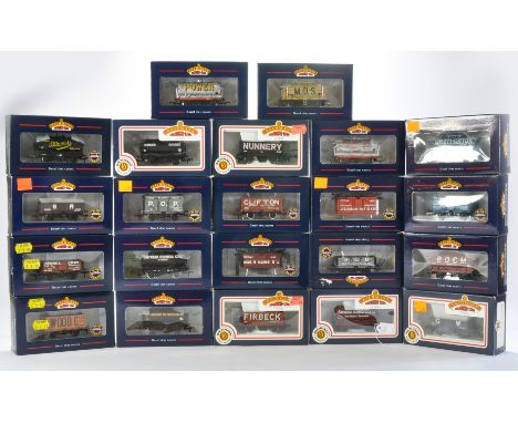 A group of 22 Bachmann Model Railway Wagons comprising 5 Plank Wagon Wooden Floor 'SR', 14 Ton Tank Wagon 'B.O.C.M.', 7 Plank