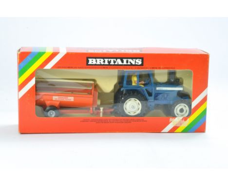 Britains Farm No. 9588 Ford TW20 Tractor and Manure Spreader Set. Looks to be very good to excellent with little sign of faul