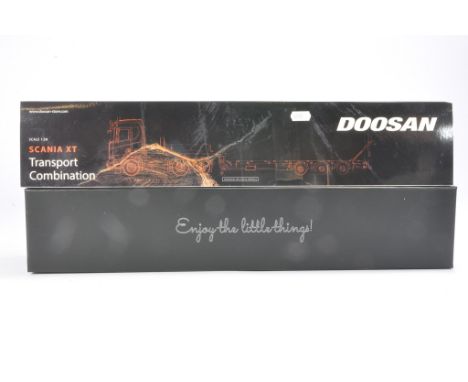 IMC Model Truck issue comprising Scania XT R Series 6X4 Nooteboom Low Loader in livery of Doosan. Not previously removed from