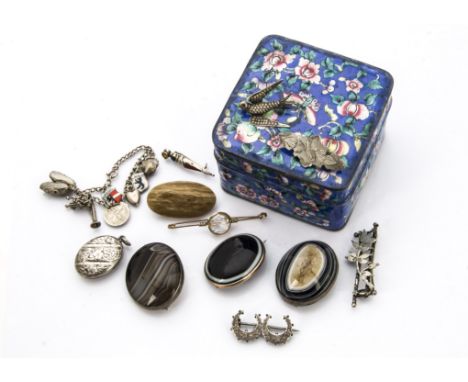 A group of seven Victorian and later brooches, one bullseye agate in gold mount, a silver mounted example and other silver br