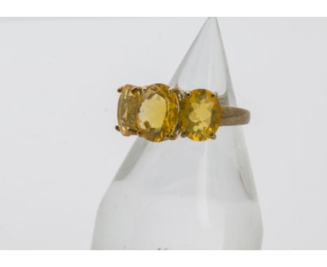 A modern 9ct gold three stone fire opal dress ring, 3.2g and size N 