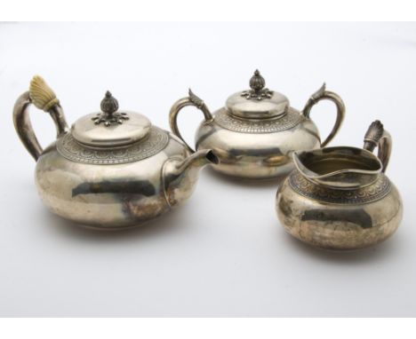 An early 20th century American sterling silver three piece tea set by Gorham, c1900, having squat bodies with neo-classical m