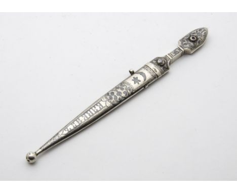 A small Russian silver paper knife, in the form of a dagger bearing Moscow strike mark and with niello decoration and word to