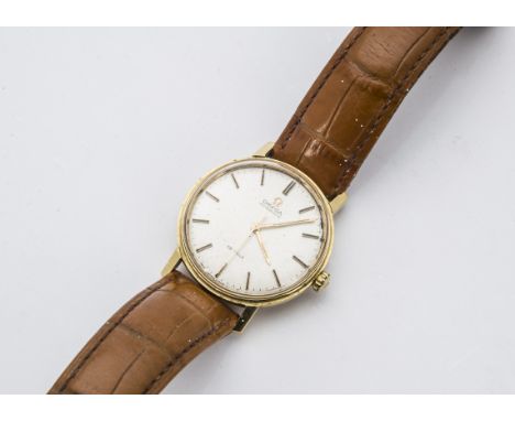 A 1960s Omega De Ville Automatic 18ct gold gentleman's wristwatch, silver dial with baton numerals to 18ct gold 34mm case, mo