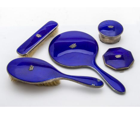 An Art Deco silver and enamelled dressing table set, comprising trinket box, compact, hair brush, damaged, hand mirror and cl