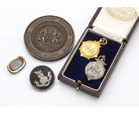 A WWI period 9ct gold life saving medal, 6.4g, together with a silver example, in Fattorini box, a WWI period Royal North Lan