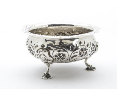 A Georgian style white metal sugar basin, this sugar bowl has three supports and embossed designs and was recently assessed b