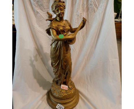 Bronze effect sculpture of a lady playing a Hurdy Gurdy, 50cm H. UK P&amp;P Group 3 (£30+VAT for the first lot and £8+VAT for