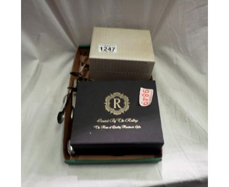 Seven pairs of sugar tongs, boxed egg cup and spoons and a boxed Ridleys stainless steel hip flash with Harris tweed cover. U