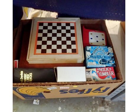 Box of mixed games, playing cards, books, magic tricks, and a card from Paul Daniels magic show. Not available for in-house P