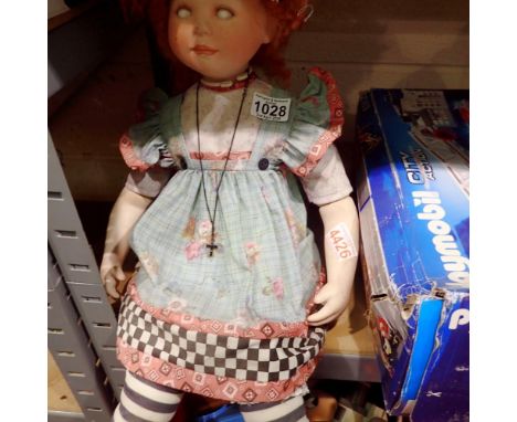 Rolling eyed doll on a stand. Emily Thorpe signature to back of head. Not available for in-house P&amp;P 