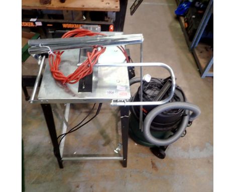 Bosch circular saw with table fitting and Bosch vacuum cleaner. Not available for in-house P&amp;P 