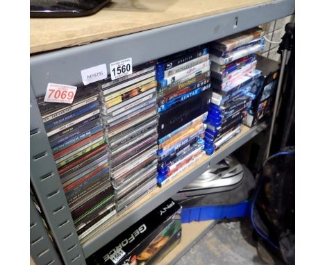 Shelf of mixed Bluray, DVDs and CDs. Not available for in-house P&amp;P
