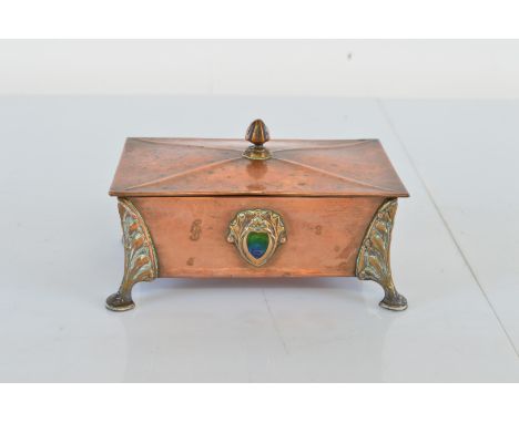 An Arts and Crafts copper and enamel lead lined footed casket, with stylised leaf, bracket supports on pad feet, with blue an