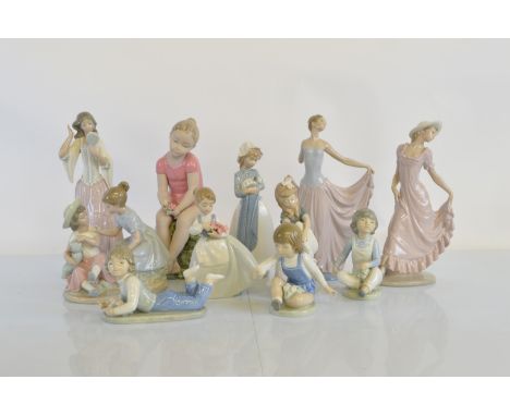 A collection of Nao porcelain figures, including ladies and child groups, together with a Lladro example (AF to arm). Tallest