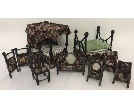 A set of handmade vintage dolls' house furniture covered in maroon floral material.Comprising a four-poster bed &amp; mattres