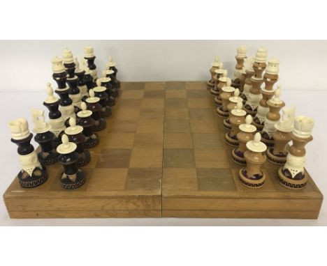 A complete boxed hand-made chess set from Central Mexico.  Constructed of wood &amp; ox bone.Box transforms into chessboard.B