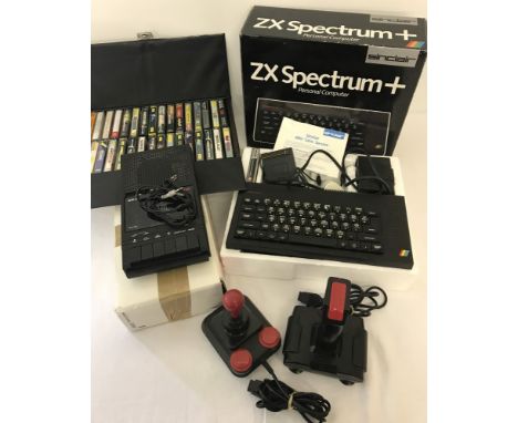 A vintage ZX Spectrum + Sinclair games console complete with original box. Together with two controllers, a Dixon's datasette