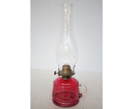 An original Victorian cranberry glass oil lamp 