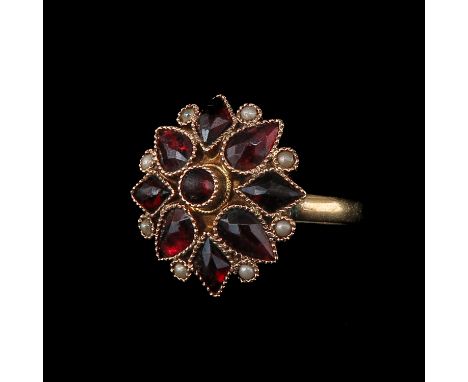 14KG set with 9 garnets ring size 15