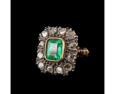 18KG with emerald measuring approx. 6.5 x 5.7 mm and diamonds ring size 15.5