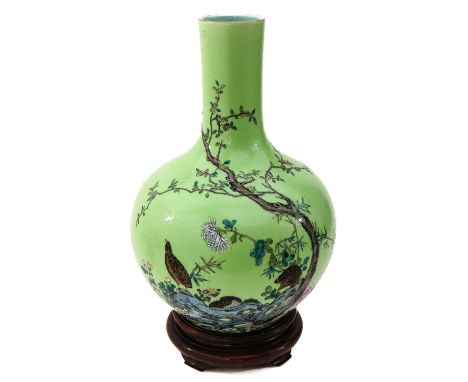 Light green sgraffito-ground with scene of quail in garden with tree and flower blossoms, Qianlong mark, 40 cm. tall. 
