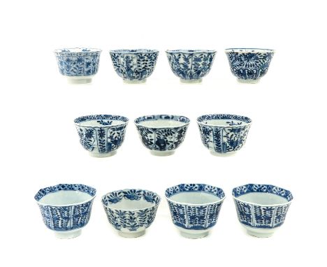 Decorated with flowers, including Kangxi mark, 9 cm. in diameter, chip and hairline.