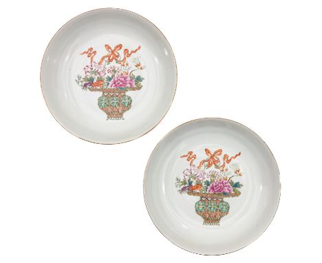 Ruby back plates decorated with basket of flowers in Famille Rose enamels, 19 cm. in diameter. 