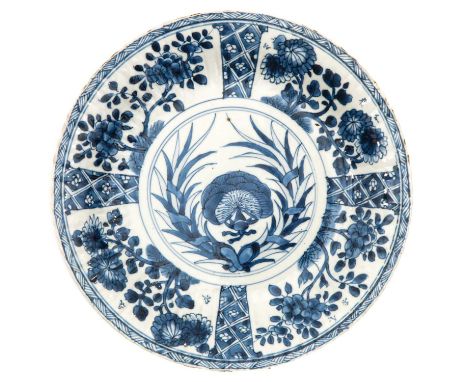 Marked with double ring, 27 cm. in diameter, chip.