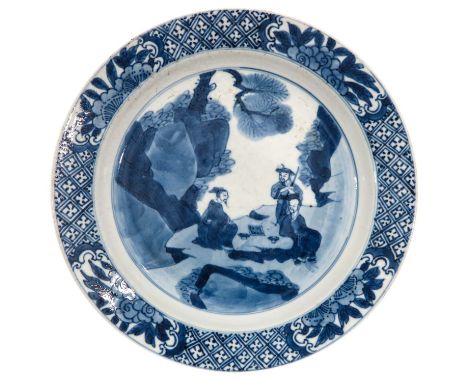 Depicting Chinese figures playing sitting at a table in a garden, chip.