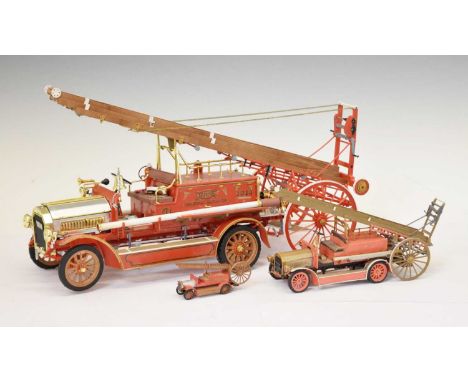 Plastic scale model of a Dennis 1914 fire engine, together with two smaller plastic model fire engines, 40cm long and smaller