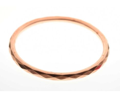 9ct rose gold hollow bangle, having diamond-cut decoration, Chester 1911, 7.4cm internal diameter, 12.3g approx