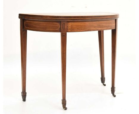 Early 19th Century inlaid mahogany demi-lune card table with green baize lining, on four tapered supports raised on castors, 