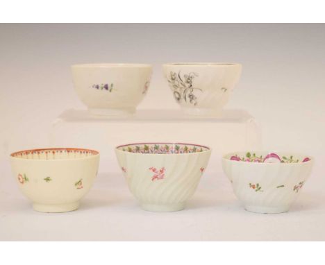 Five late 18th or early 19th Century porcelain tea bowls, each painted with floral sprays, to include New Hall examples, 8.5c