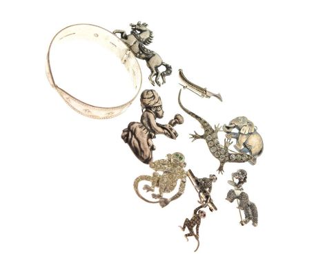 Quantity of silver and white metal brooches, including a silver marcasite monkey brooch, a Danecraft poodle brooch, khanjar d