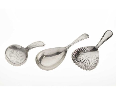 George III silver caddy spoon, Birmingham 1813, George V silver caddy spoon, Sheffield 1934, 23g approx, together with a plat