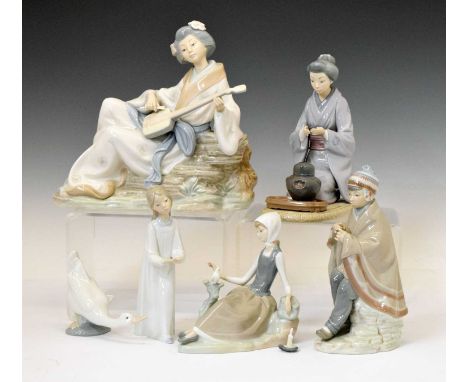 Three Lladro porcelain figures comprising; Geisha serving tea (5122), Shepherdess With Dove (4660) and Girl with candle (4868