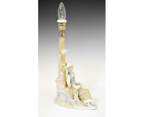 Lladro - Porcelain lamp base on a maid resting beside a tree with a dove, 29cm high (ex.fitting)