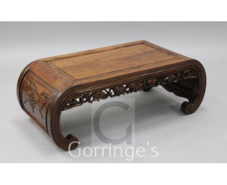 A Chinese hardwood rectangular topped opium table, the scroll ends carved with prunus blossom, width 3ft 2in.