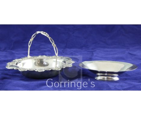 A late 1920's/early 1930's Georg Jensen planished sterling silver oval nut dish, design no. 568C, on oval foot, 4.75in, toget