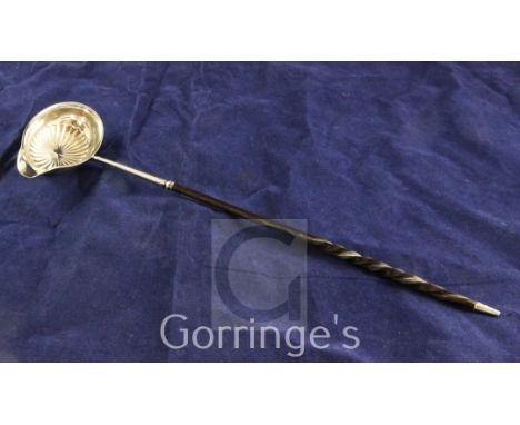 A George III silver toddy ladle, with fluted bowl and demi-spiral twist baleen handle, Thomas Lamborn, Sheffield, 1800, 13.25