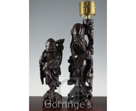 Two Chinese carved rootwood figures, one fitted as a candle lamp, 14in and 11in.
