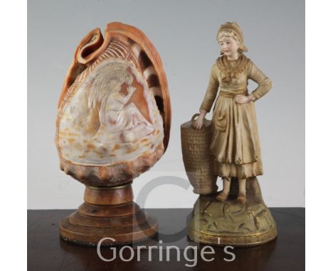 An Ernst Wahliss porcelain figural spill holder, and a cameo carved conch shell mounted as a lamp, late 19th/early 20th centu