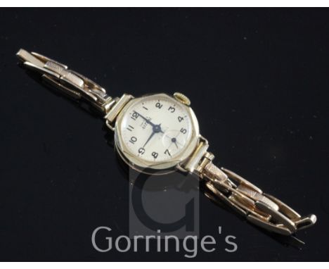 A lady's early 1960's 9ct gold Astral manual wind octagonal wrist watch, with Arabic dial and subsidiary seconds, on a 9ct go