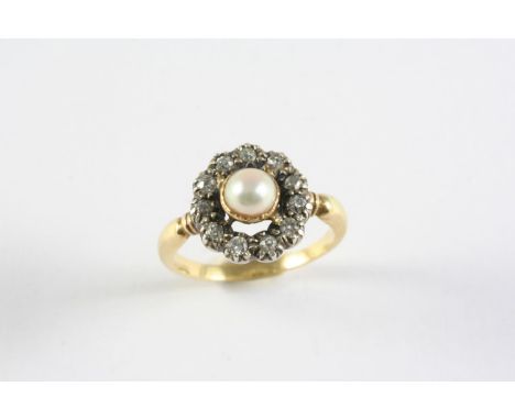 A VICTORIAN DIAMOND AND PEARL CLUSTER RING the central pearl in closed back setting and set within a surround of circular old