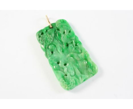A JADE PENDANT of pierced and carved form, 5.5 x 3cm