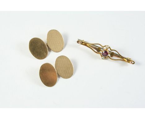 A PAIR OF 9CT GOLD CUFFLINKS of oval form, each with one plain link and one with engine turned decoration, 5.0 grams, togethe