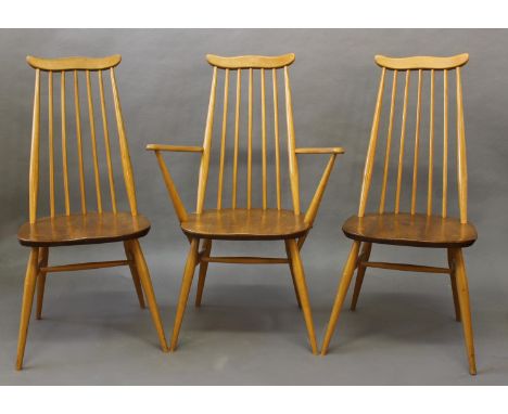 ERCOL DINING CHAIRS a set of four vintage light elm and beech stick back chairs (two carvers and two single chairs). With Erc