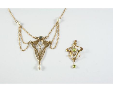 AN ART NOUVEAU GOLD AND PEARL SET PENDANT the foliate openwork mount suspends a cultured pearl, with further pearls set to th
