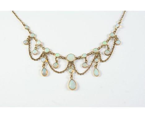 AN OPAL AND GOLD DROP NECKLACE the gold chain mounted with graduated circular collet set white opals, suspending circular and